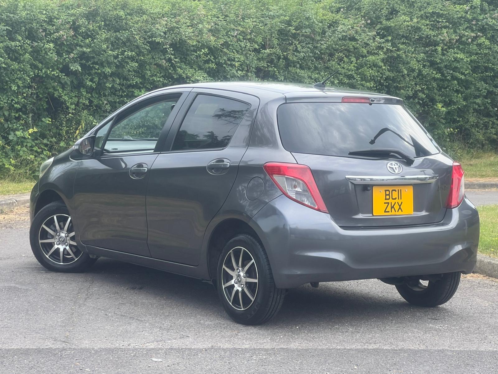 TOYOTA VITZ 2011, 1.0 PETROL FULLY LOADED, 5 SEATER, PEARL GREY PAINT, BLACK / BEIGE CLOTH INTERIOR