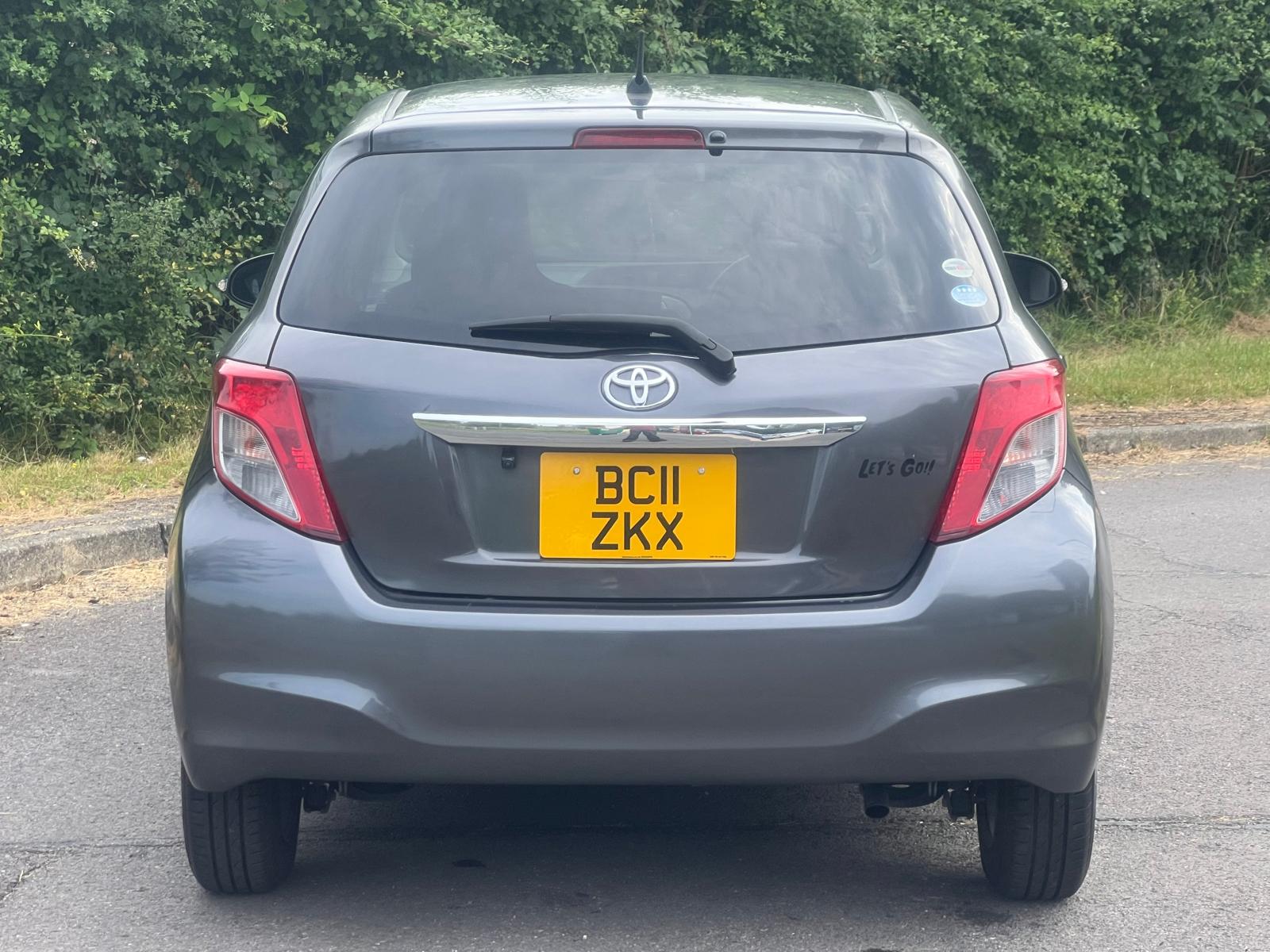 TOYOTA VITZ 2011, 1.0 PETROL FULLY LOADED, 5 SEATER, PEARL GREY PAINT, BLACK / BEIGE CLOTH INTERIOR